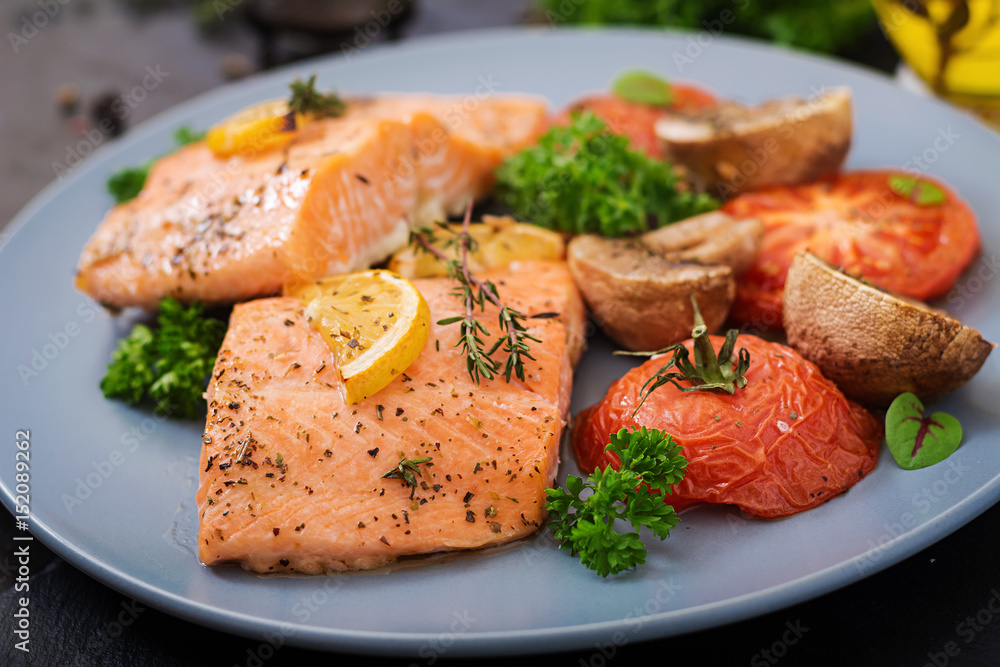 Baked salmon fish fillet with tomatoes, mushrooms and spices. Diet menu. Baked salmon fish fillet with tomatoes, mushrooms and spices. Diet menu.