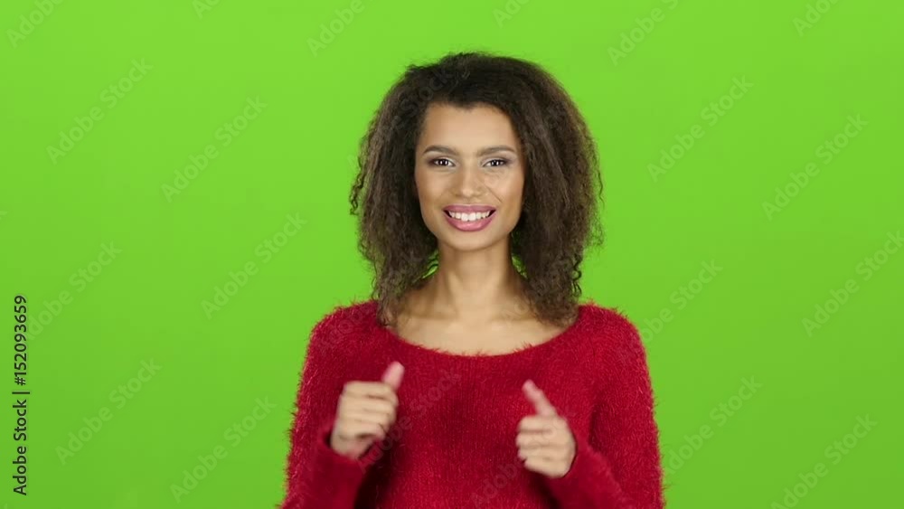 Woman showing two thumbs up, gesture. Slow motion, green screen Woman showing two thumbs up, gesture. Slow motion, green screen