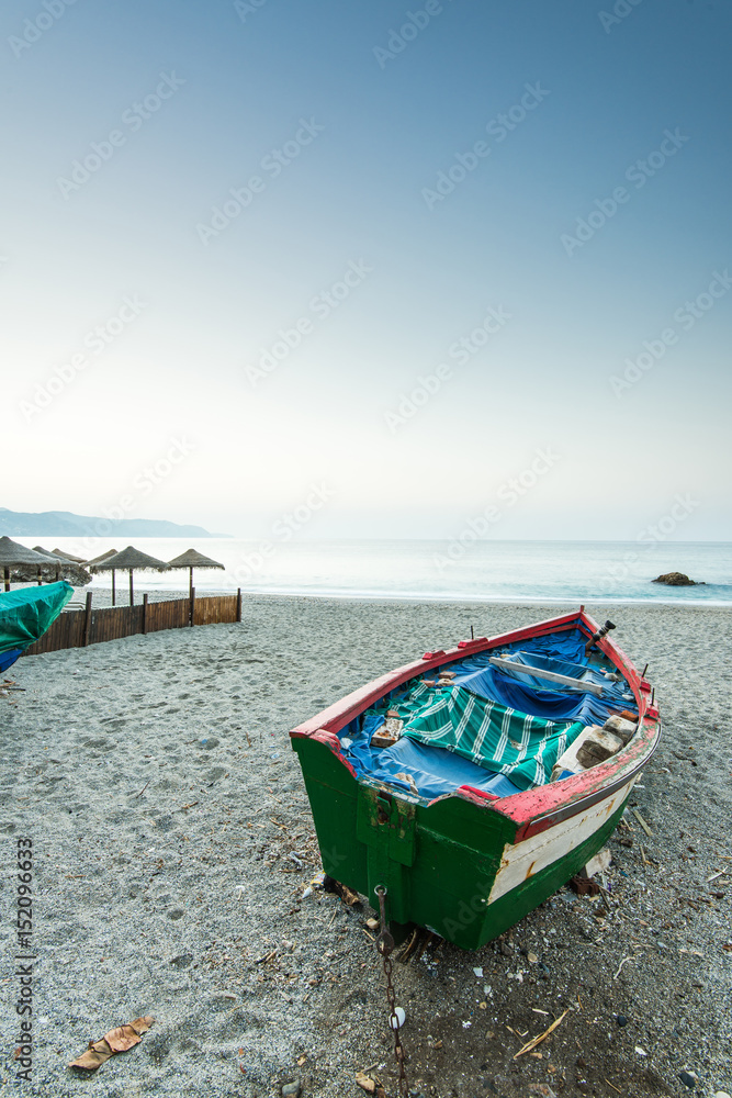 Old fishing boat on the beach in Nerja,Spain