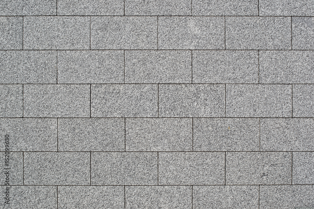 Fototapeta premium The texture of a wall of granite blocks