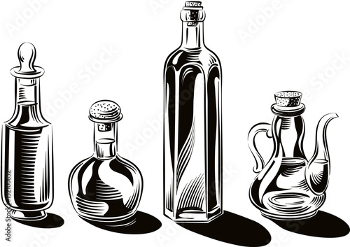Bottles and glass containers of extra virgin olive oil.
