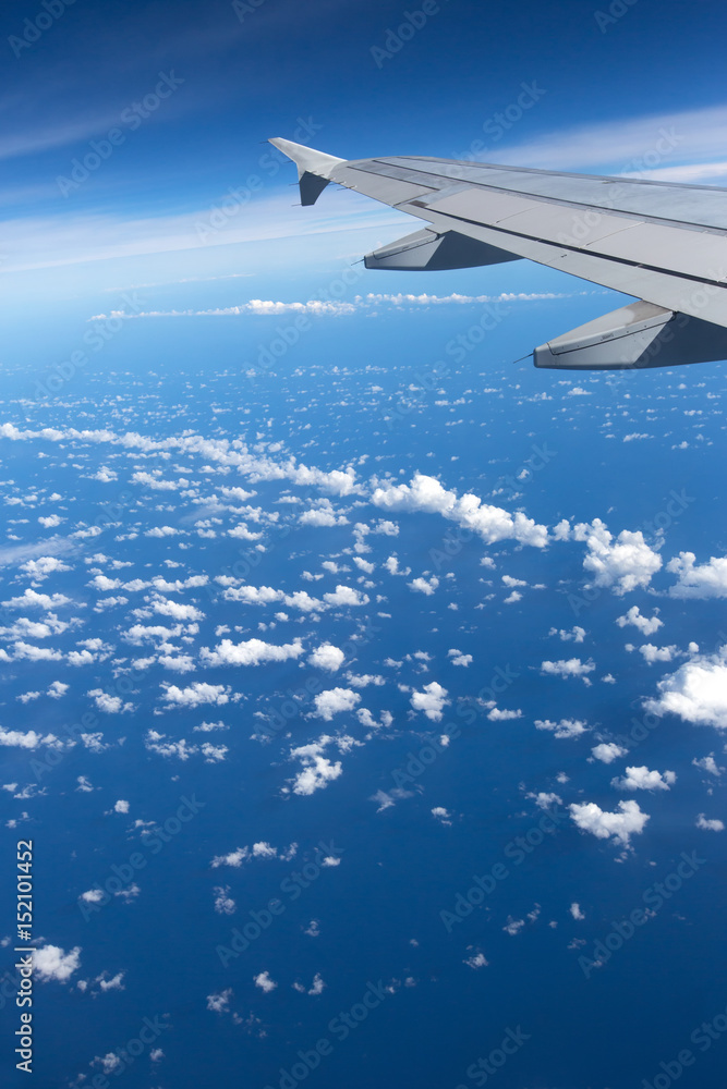 Fototapeta premium Above the clouds.Wing aircraft on the sky