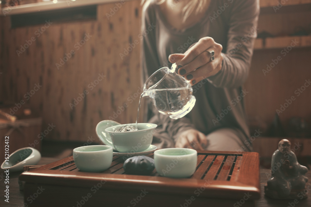 young beautiful blonde woman making tea ceremony young beautiful blonde woman making tea ceremony