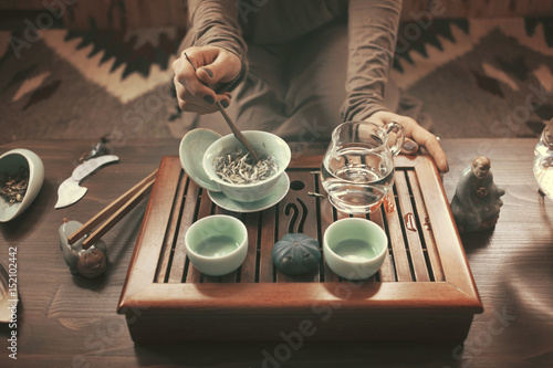 young beautiful blonde woman making tea ceremony