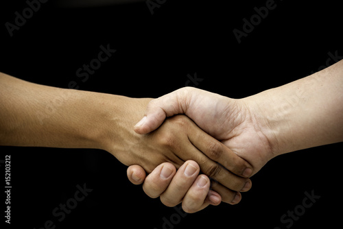 Teamwork of two people on black background