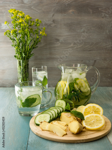 Ginger lemonade and ingredients - ginger, lemon, lime, mint