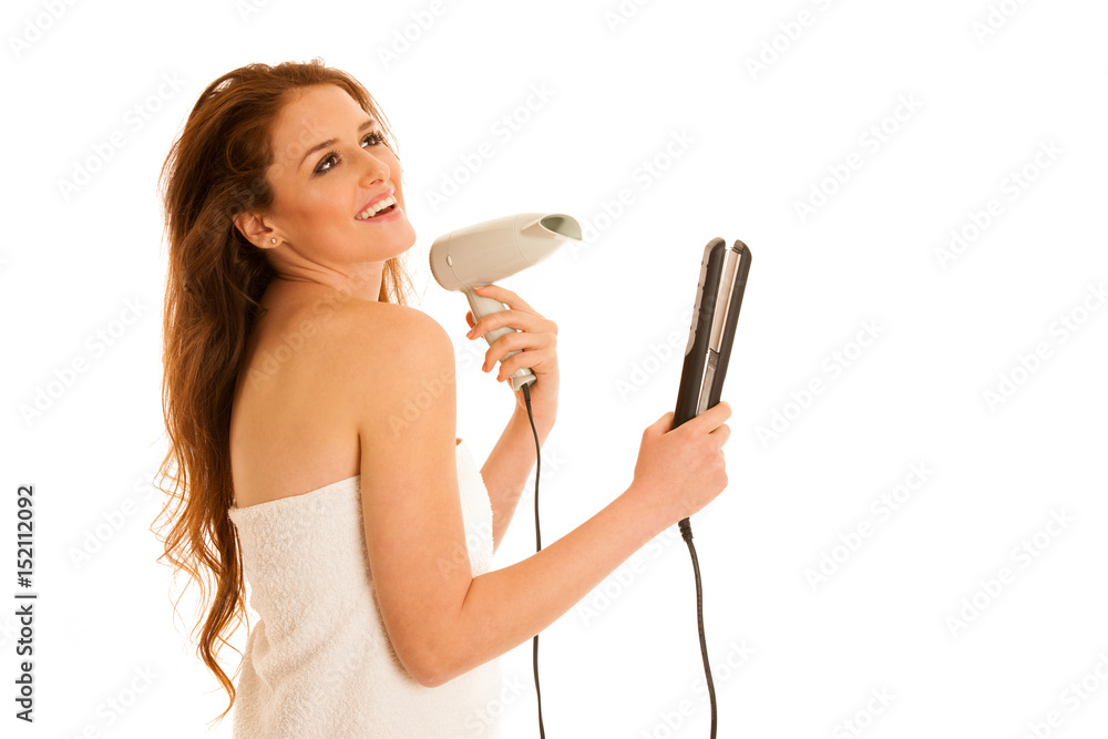 Beautiful young woman holds hair brush and blow dryer isolated over white bavkground