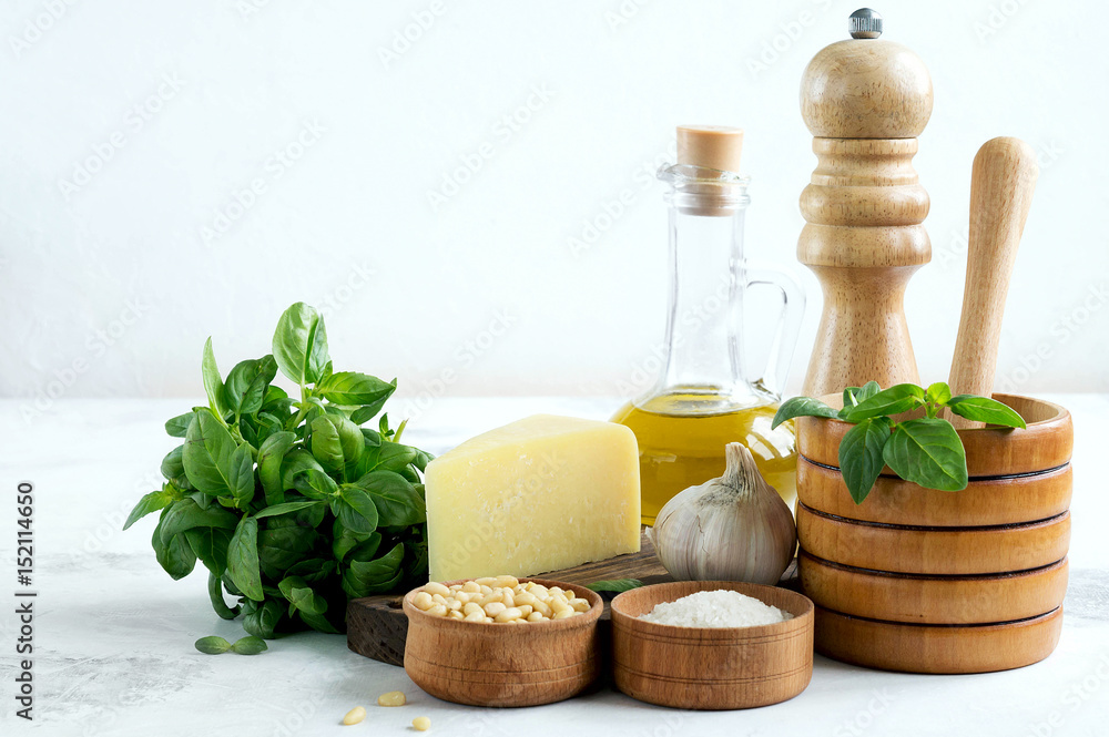 Ingredients for pesto on a white background.