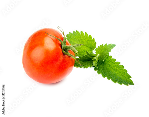 one fresh red tomato isolated on white photo