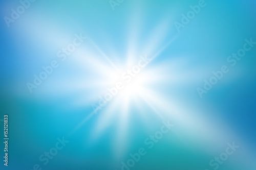 bright sun on blue sky background with lens flare © denzelll