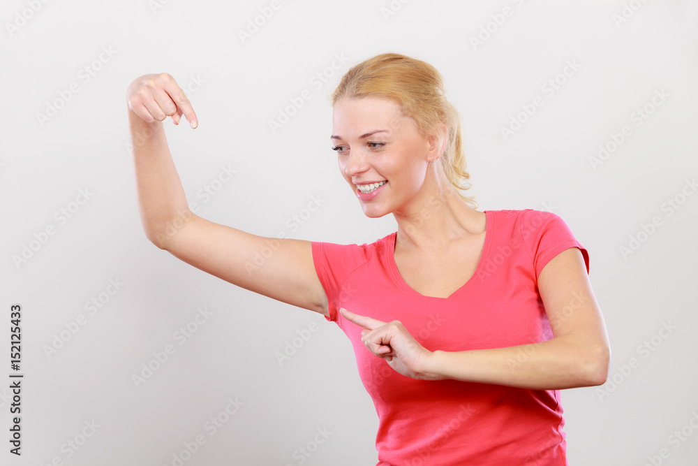 Happy woman pointing on left side Happy woman pointing on left side