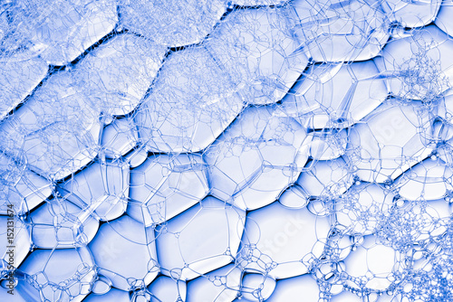 Background of close up view on blue soap bubbles