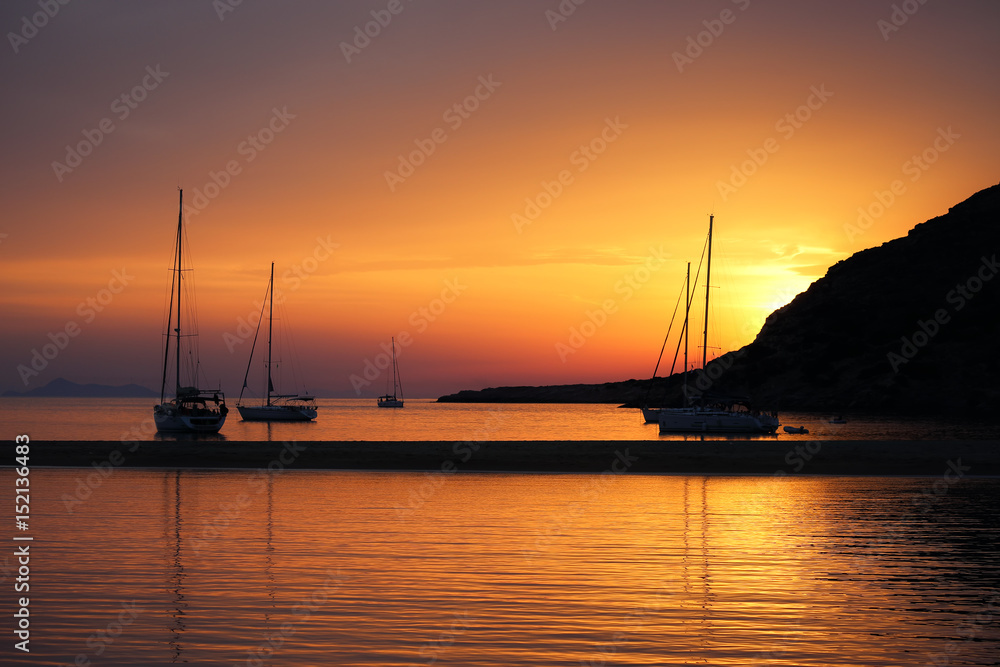 Fabulous Sunset in Kolona double bay, Kythnos, Cyclades, Greece. Sailboats