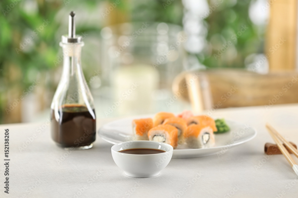 Composition with tasty soy sauce on table Composition with tasty soy sauce on table