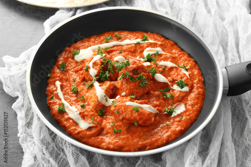 Murgh Makhani in frying pan on table