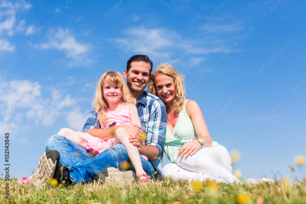 Mother, father, child, sitting in open air Mother, father, child, sitting in open air