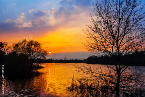 quiet lake scene at the sunset © Yuriy Kulik