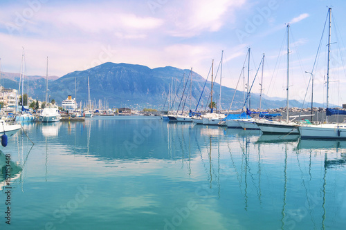 sailboats reflected on sea Kalamata port Greece photo