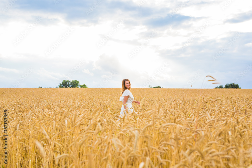 Young woman on a field Young woman on a field