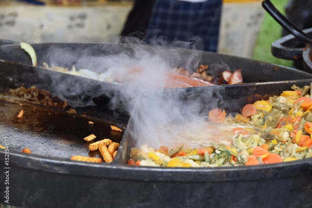 Cooking food for people at a festival Cooking food for people at a festival