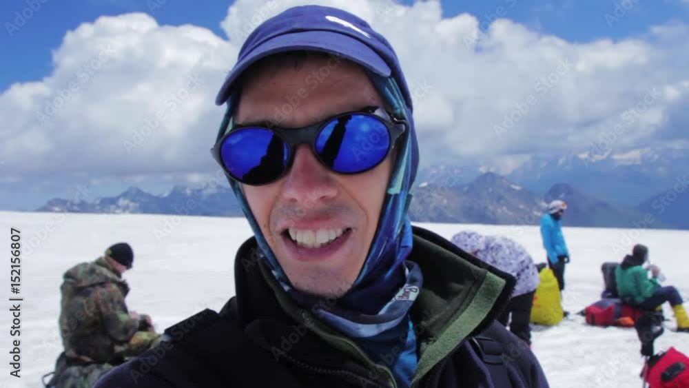 A man makes selfie in yhe slope of Elbrus mountain A man makes selfie in yhe slope of Elbrus mountain