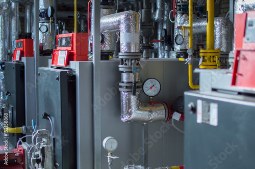 Modern high power industrial gas boilers with natural gas burners in the gas boiler plant