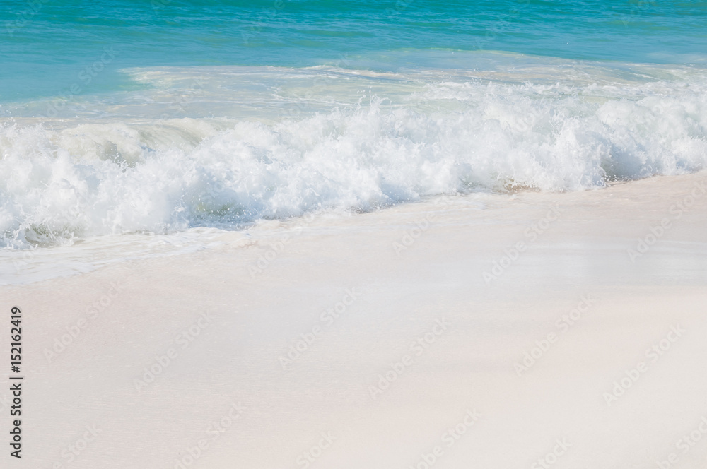 Turquoise sea with white waves and white sand. Turquoise sea with white waves and white sand.