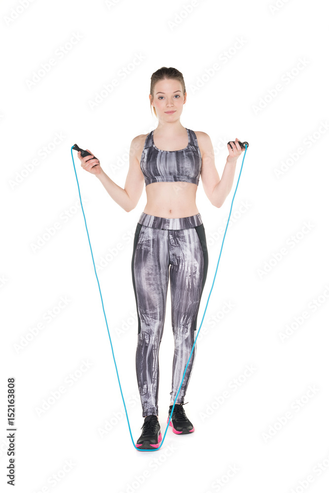 Young, pretty, natural looking girl in sport bra and leggings. Studio shot, pure white background Young, pretty, natural looking girl in sport bra and leggings. Studio shot, pure white background