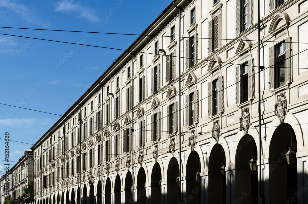 Fototapeta premium Colonnade and antique palaces of via Po, one of the main baroque streets of the center of Turin (Piedmont, Italy)