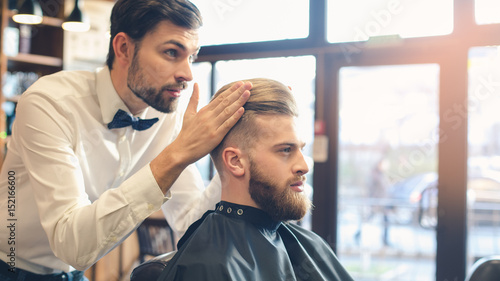 Young Man in Barbershop Hair Care Service Concept