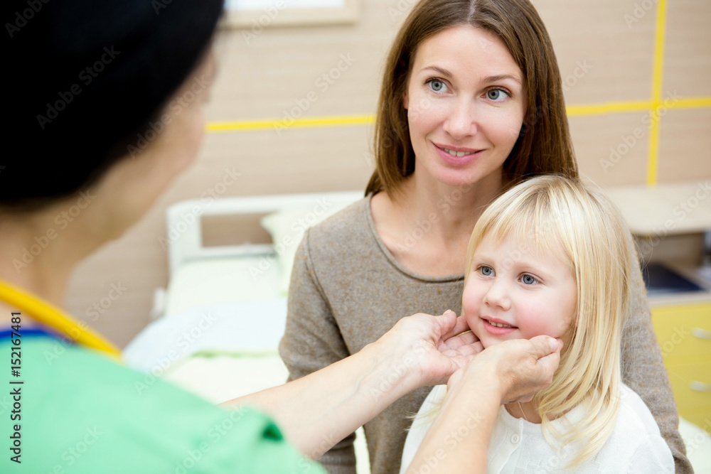Beautiful woman and her cute little daughter visiting pediatrician Beautiful woman and her cute little daughter visiting pediatrician