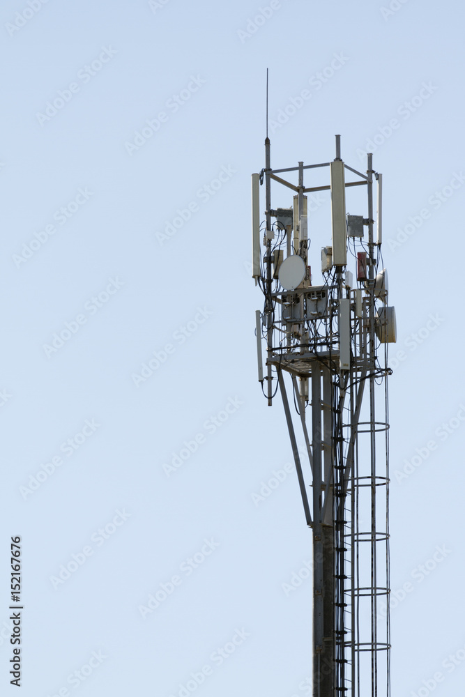 Cellular phone transmitter. Cell phone antenna with blue sky Cellular phone transmitter. Cell phone antenna with blue sky
