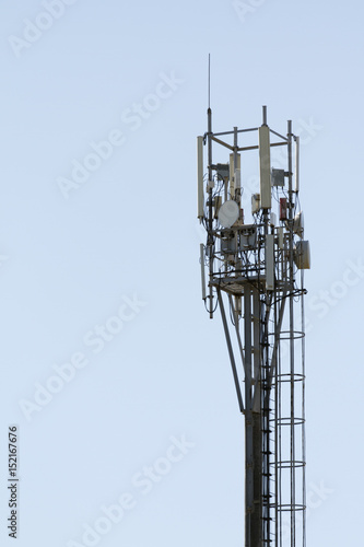 Cellular phone transmitter. Cell phone antenna with blue sky