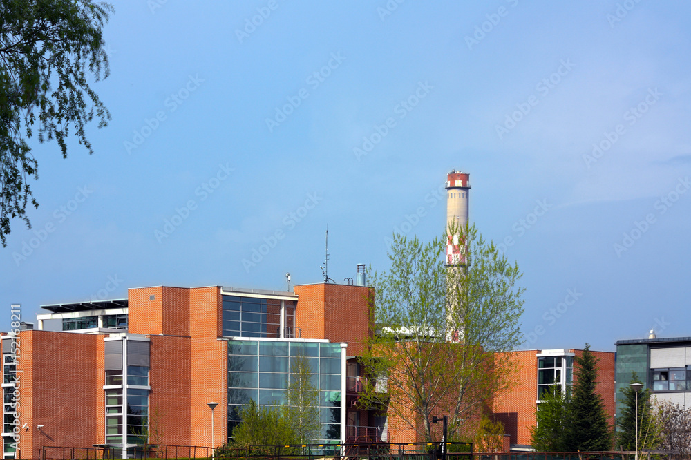 Office building with red bricks and chimney
