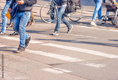 people crossing the pedestrian crossing