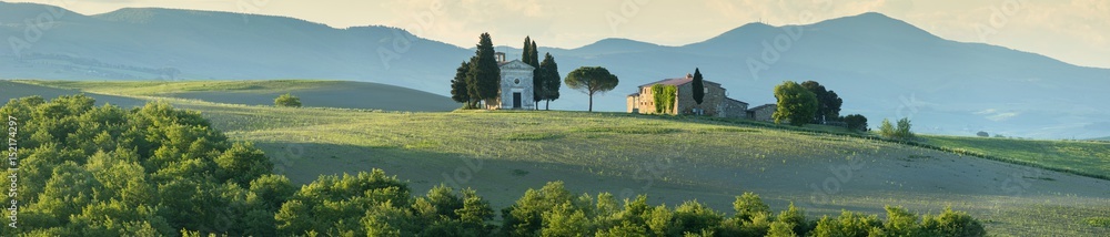 panorama with old chapel in morning light in Tuscany