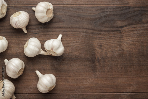 fresh garlic on the brown wooden table