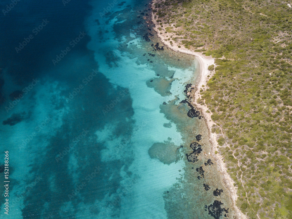 Aerial view of the Sardinian Emerald Coast, with its turquoise sea. in Sardinia Island, is one of the most beautiful and famous coasts in the world Aerial view of the Sardinian Emerald Coast, with its turquoise sea. in Sardinia Island, is one of the most beautiful and famous coasts in the world