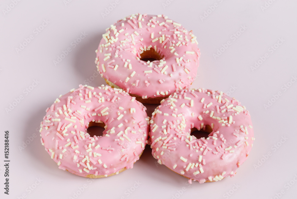 Pink donut on plain background Pink donut on plain background
