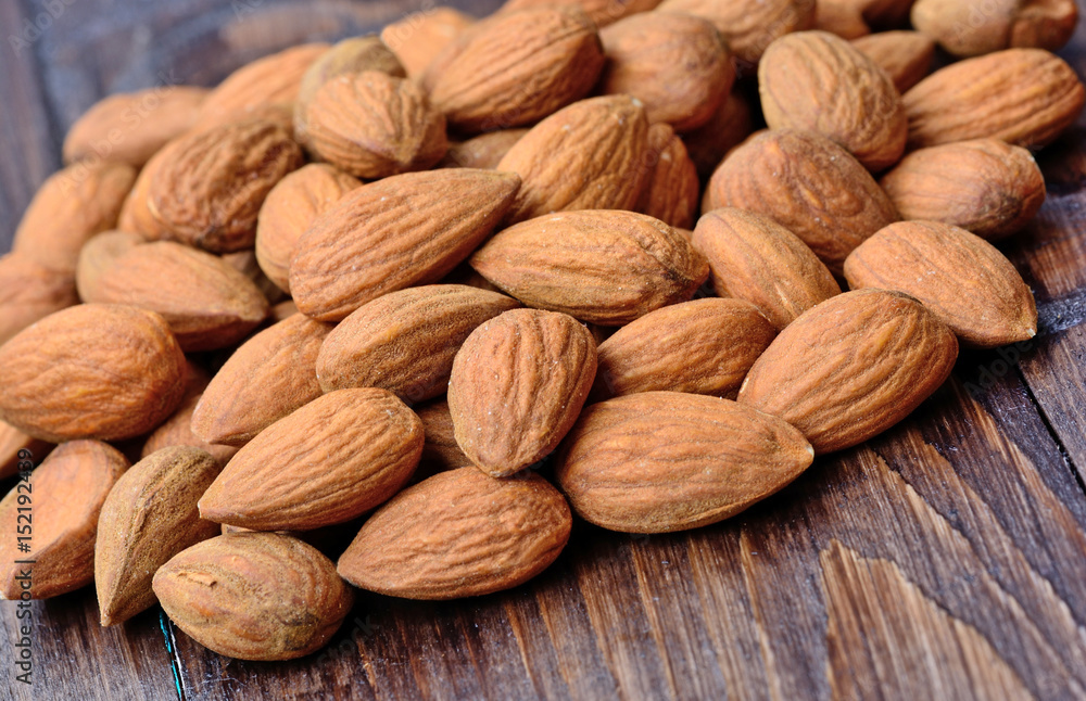 Heap of almonds on table