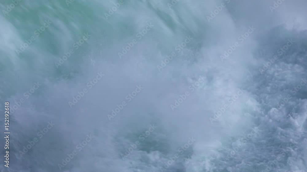 Close up of water falling down in Huka Falls New Zealand Close up of water falling down in Huka Falls New Zealand