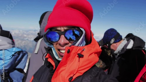 A man makes a selfie on top of Mount Elbrus in a state of mountain sickness