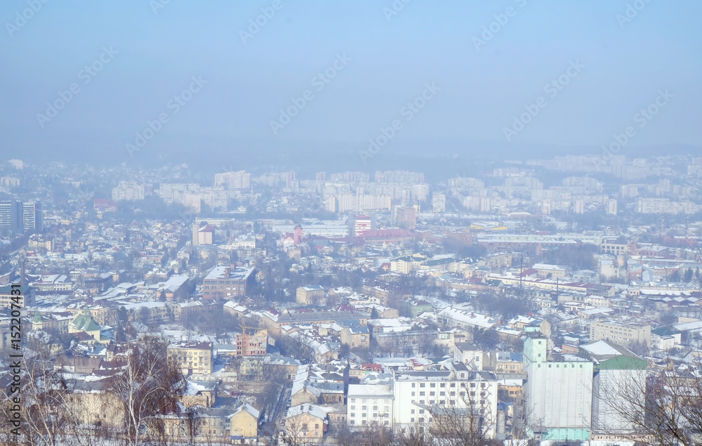 View of city from hill in winter