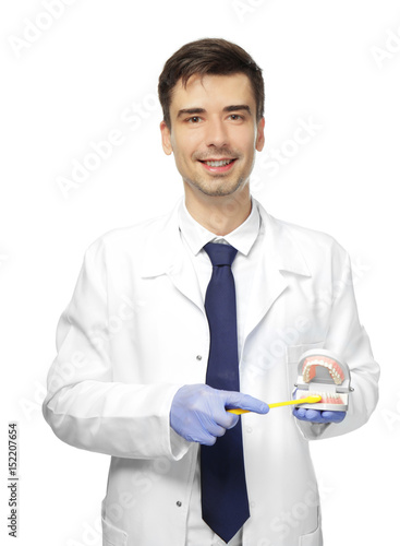Handsome young dentist with...