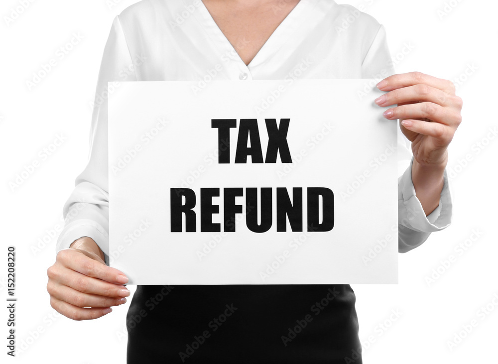 Woman holding paper sheet with text TAX REFUND on white background Woman holding paper sheet with text TAX REFUND on white background