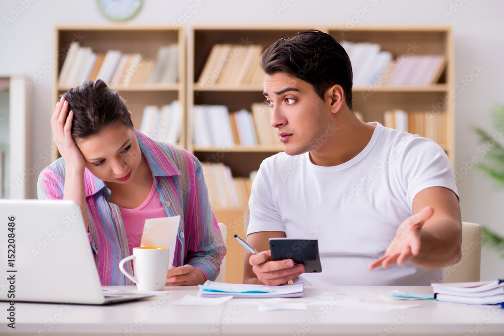 Young family discussing family finances Young family discussing family finances