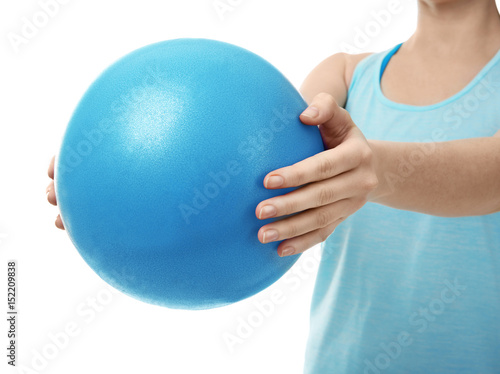 Woman with rubber ball on white background, closeup