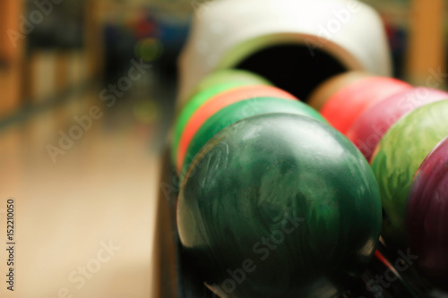 Colorful balls on rack in bowling club  closeup