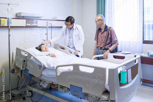 Male doctor speaking with patient