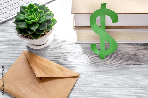 student's desk with dollar sign for fee-paying education set gray background photo